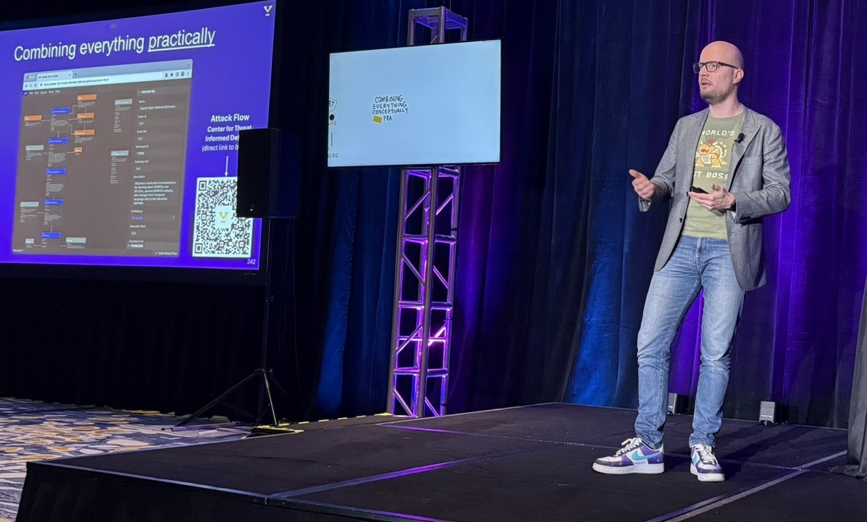 Venation founder presenting scenario-based threat modelling on stage